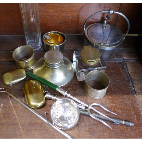 674 - A collection of plated items including inkwell, napkin rings, sovereign holder, pot, etc.