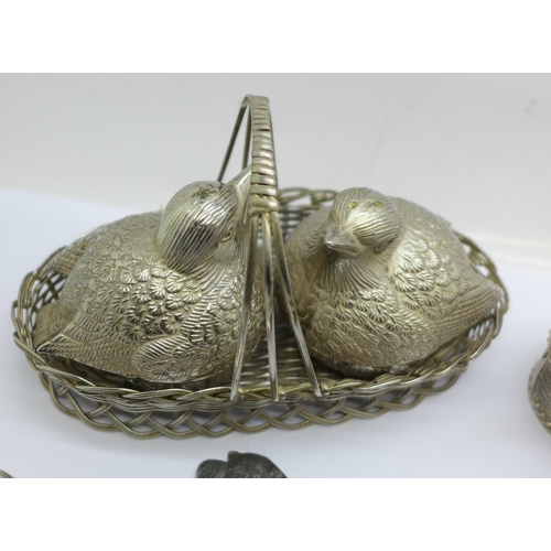 683 - A silver plated birds in basket cruet set, apple and pear in basket cruet set, tea pot and salad ser... 