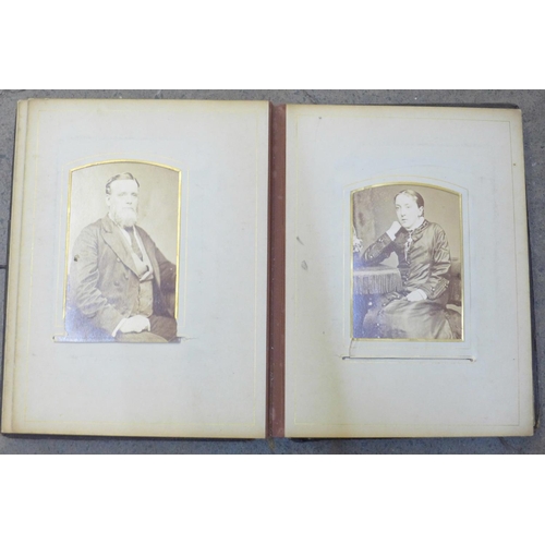 688 - An album of Victorian photographs and cabinet cards (48)