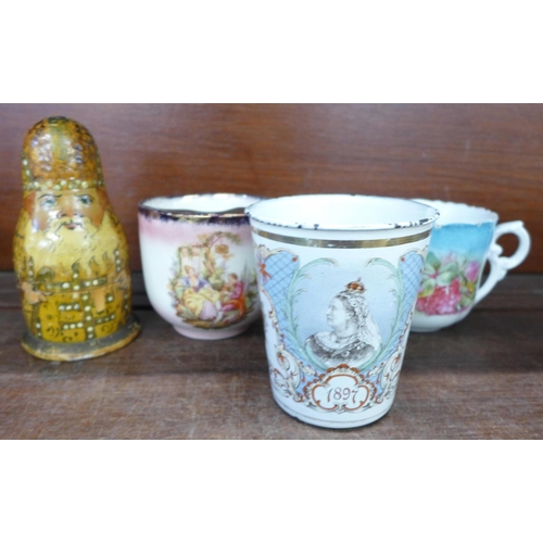 706 - Two Victorian moustache cups, a Russian doll and a Victorian commemorative mug