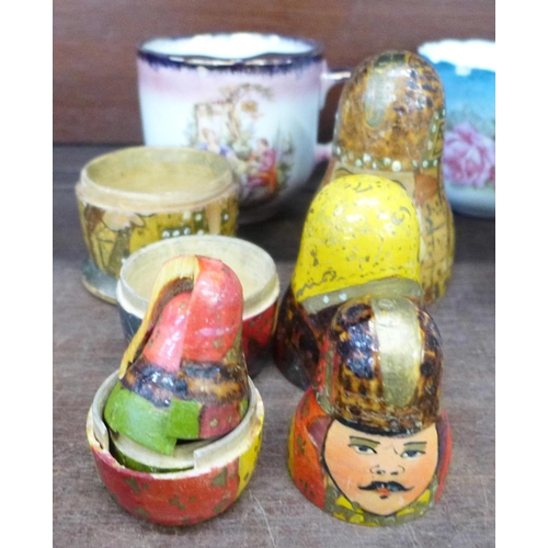 706 - Two Victorian moustache cups, a Russian doll and a Victorian commemorative mug