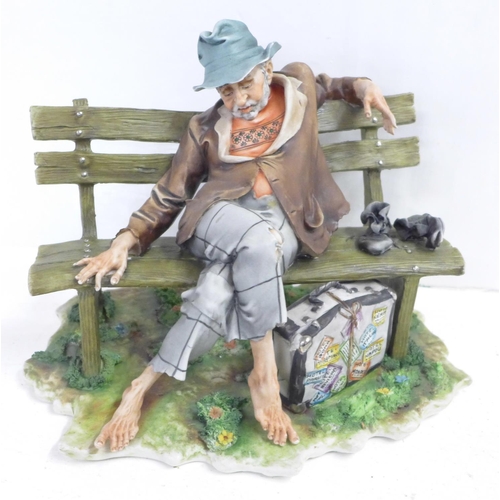 708 - A Capodimonte figure, Tramp on Bench, signed with certificate