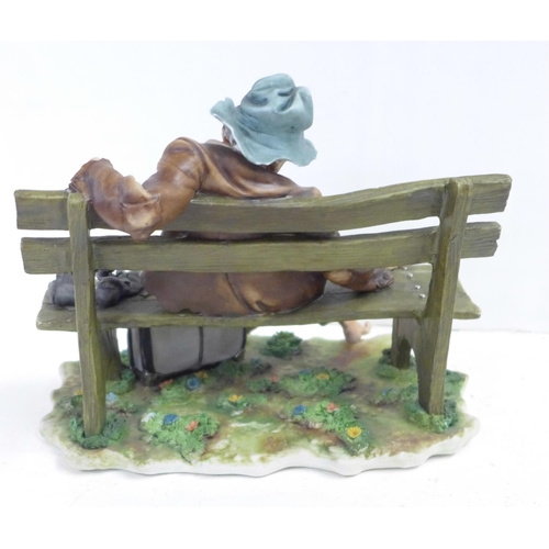 708 - A Capodimonte figure, Tramp on Bench, signed with certificate