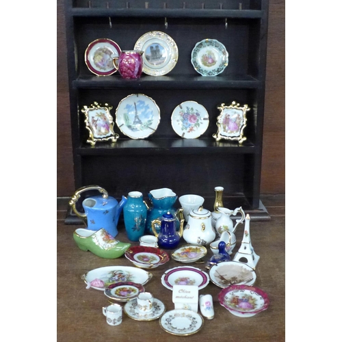 726 - A collection of Limoges china and a display case