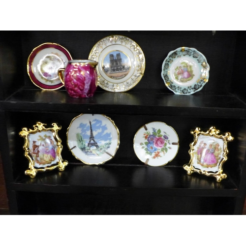 726 - A collection of Limoges china and a display case