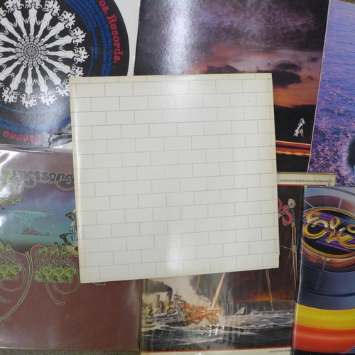 759 - A collection of ten LP records; Pink Floyd's The Wall (1st pressing), Yes x2, ELO, Genesis, etc.