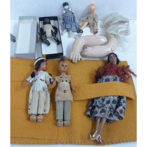 785 - A collection of small dolls and two dolls arms