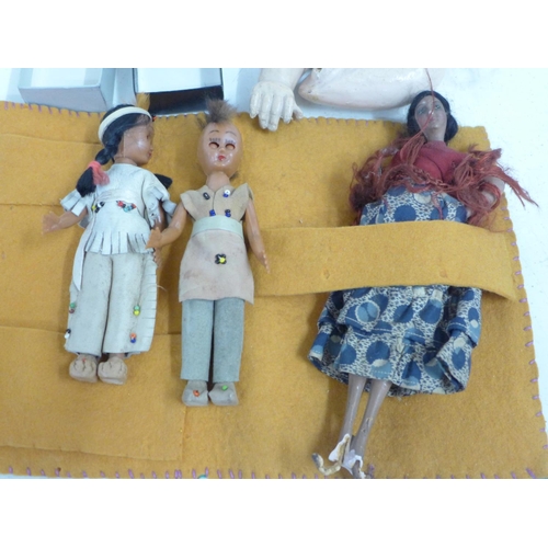 785 - A collection of small dolls and two dolls arms