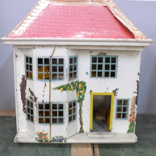 810 - A tin plate and wooden doll's house with furniture, 41cm, roof a/f