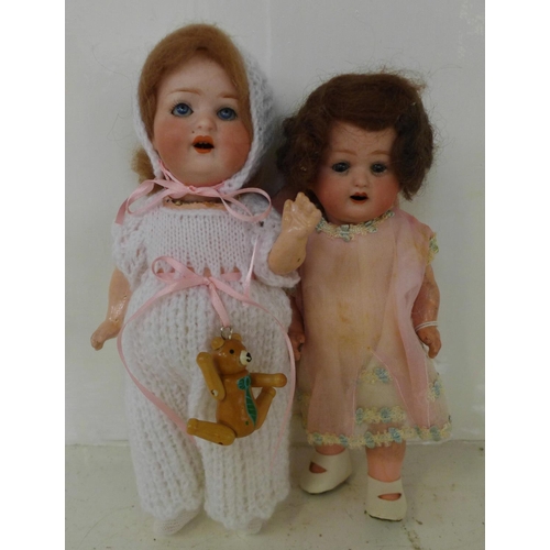 833 - Two dolls; a German Heubach bisque head doll with pale blue sleep eyes, 500 14/0 identification mark... 