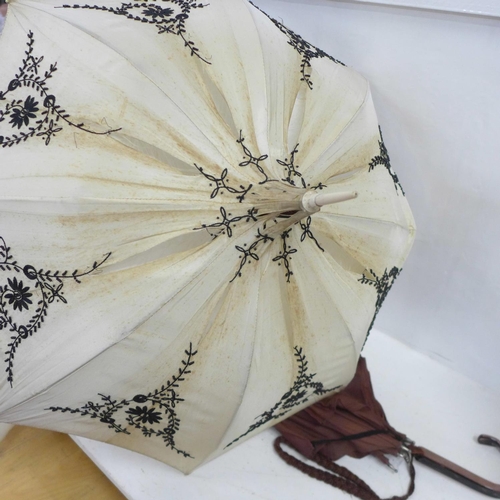 839 - A parasol with embroidered and beaded decoration and a circa 1960's umbrella