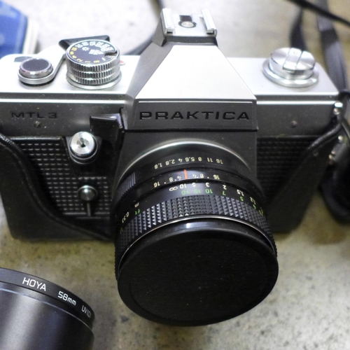 843 - Three Praktica 35mm film cameras with lenses; LB, LTL3 and MTL3, two additional zoom lenses, flash g... 