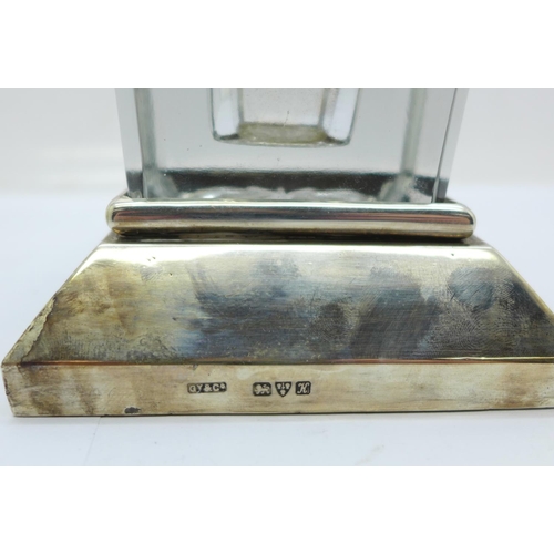 849 - A silver ink stand, Chester 1910, the glass inkwell with plated top