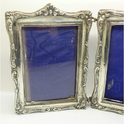 854 - A twin silver photograph frame, Birmingham 1904, one lacking glass, height 19.5cm, (some a/f, back w... 