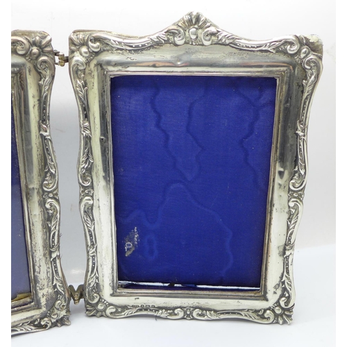 854 - A twin silver photograph frame, Birmingham 1904, one lacking glass, height 19.5cm, (some a/f, back w... 