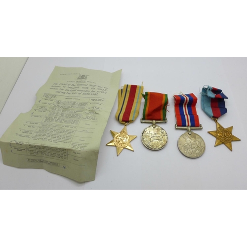 878 - A set of four WWII medals to W153189 C.W. Davies, with slip