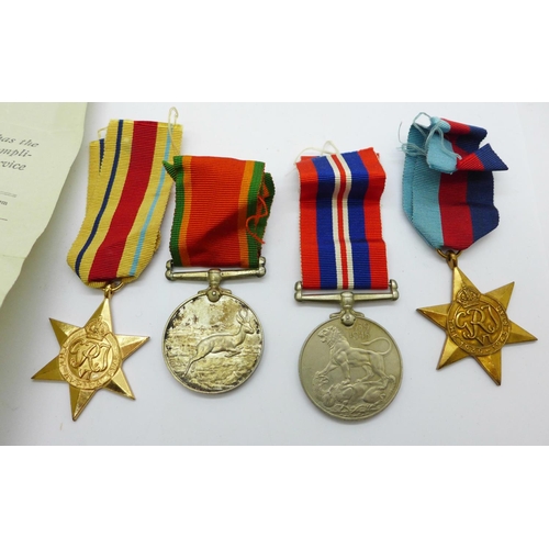 878 - A set of four WWII medals to W153189 C.W. Davies, with slip