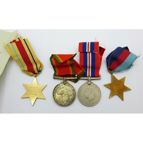 878 - A set of four WWII medals to W153189 C.W. Davies, with slip