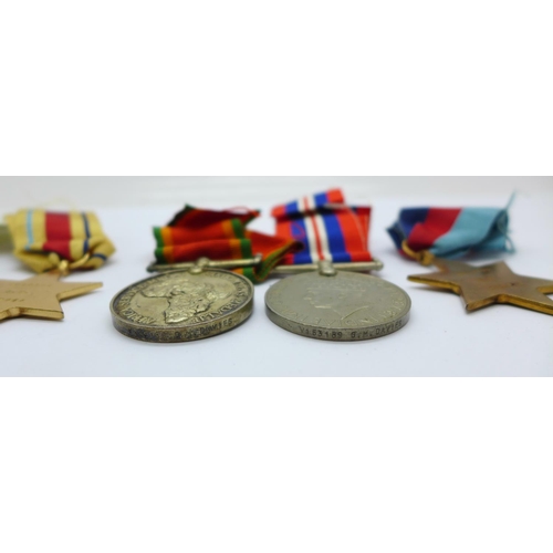 878 - A set of four WWII medals to W153189 C.W. Davies, with slip