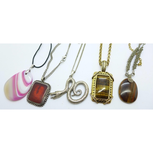 921 - Pendants including tigers eye set