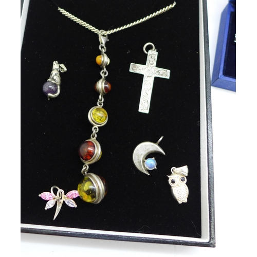 922 - A silver and multi-coloured amber set pendant and chain, a Swarovski bracelet, boxed, and silver cha... 