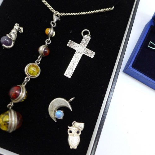 922 - A silver and multi-coloured amber set pendant and chain, a Swarovski bracelet, boxed, and silver cha... 