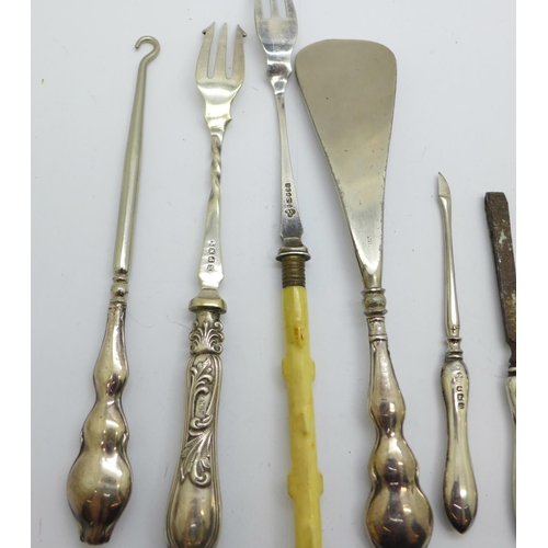 924 - Three silver manicures, a silver handled shoe horn and button hook and two forks