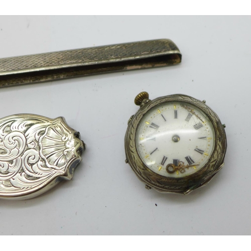 925 - A silver cased watch, a/f, a Victorian silver handle, a silver comb back and a silver and mother of ... 