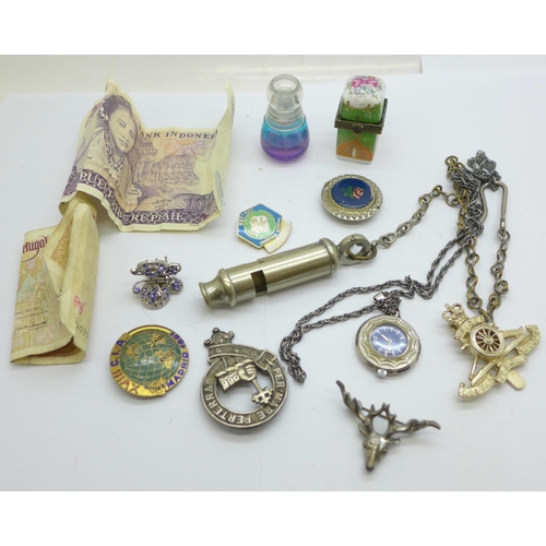 928 - Assorted items including a scent bottle, badges, a whistle with broad arrow, etc.