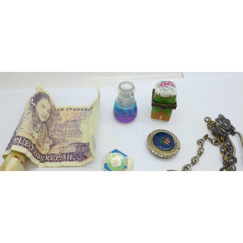 928 - Assorted items including a scent bottle, badges, a whistle with broad arrow, etc.