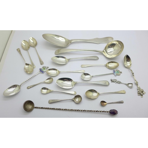 929 - A collection of silver spoons including a Georgian ladle, a large continental spoon, tea spoons, con... 