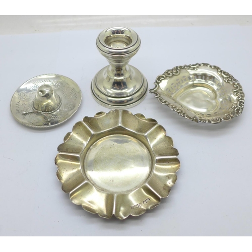 932 - Two silver dishes, a silver candle holder and a novelty 925 silver hat, weight without candle holder... 