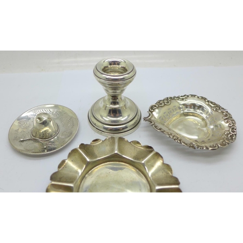 932 - Two silver dishes, a silver candle holder and a novelty 925 silver hat, weight without candle holder... 