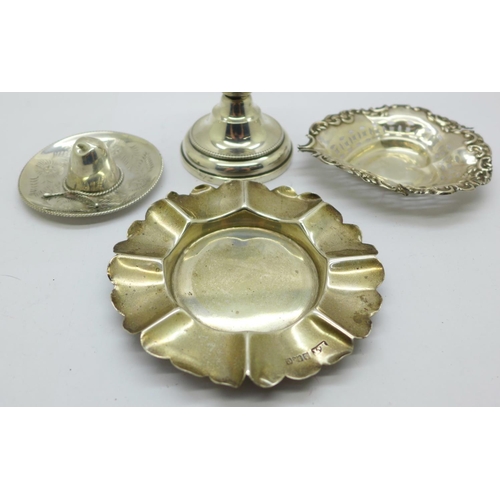 932 - Two silver dishes, a silver candle holder and a novelty 925 silver hat, weight without candle holder... 