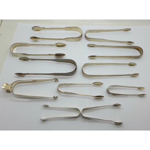 937 - Ten pairs of silver sugar tongs, 284g, and one plated pair