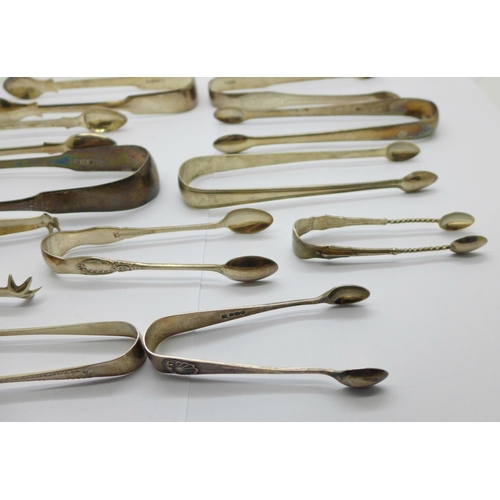 937 - Ten pairs of silver sugar tongs, 284g, and one plated pair