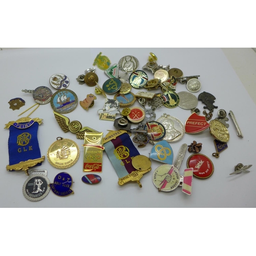 963 - A collection of badges and medallions, etc.