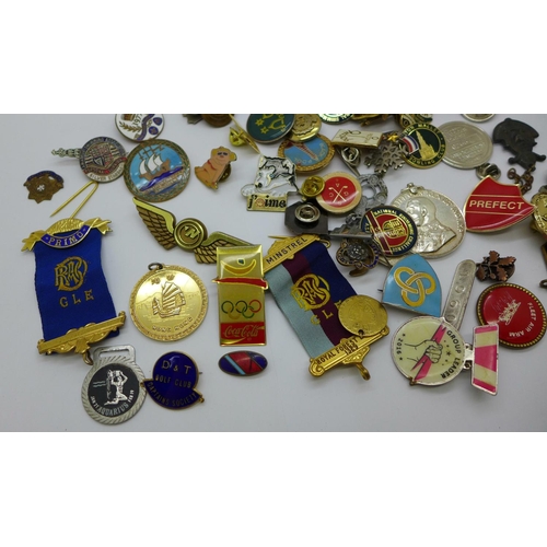 963 - A collection of badges and medallions, etc.