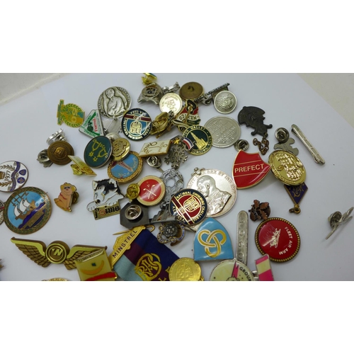 963 - A collection of badges and medallions, etc.