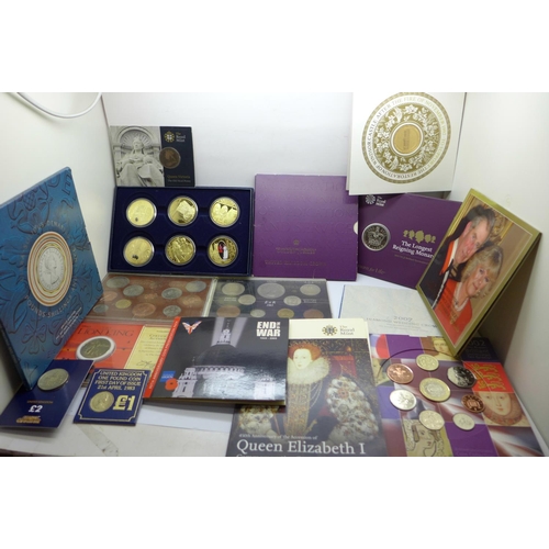 978 - A collection of commemorative coin sets including four £5 coins, a 2002 UK Brilliant Uncirculated Co... 