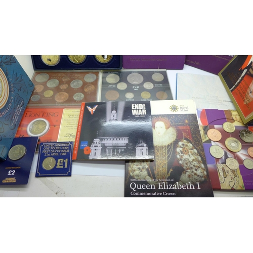 978 - A collection of commemorative coin sets including four £5 coins, a 2002 UK Brilliant Uncirculated Co... 