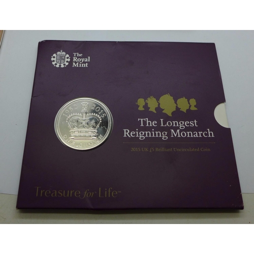 978 - A collection of commemorative coin sets including four £5 coins, a 2002 UK Brilliant Uncirculated Co... 