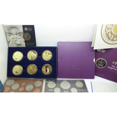 978 - A collection of commemorative coin sets including four £5 coins, a 2002 UK Brilliant Uncirculated Co... 