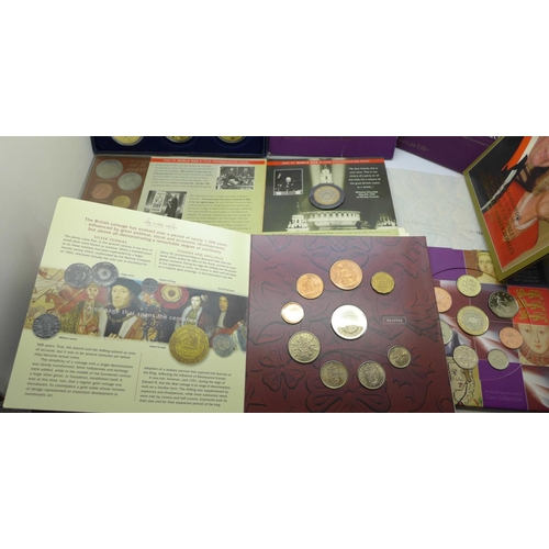 978 - A collection of commemorative coin sets including four £5 coins, a 2002 UK Brilliant Uncirculated Co... 