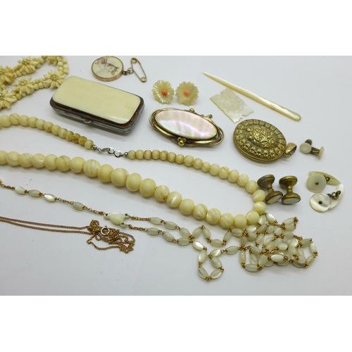 980 - Costume jewellery including a Victorian mother of pearl brooch, beads, earrings, rosary beads, locke... 