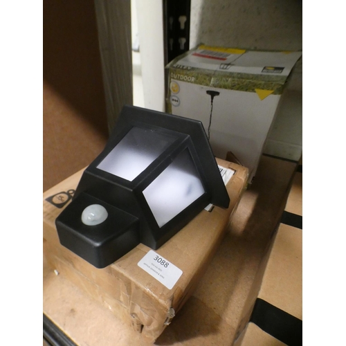 3088 - Solar wall lamp and a metal hanging lantern light * This lot is subject to VAT