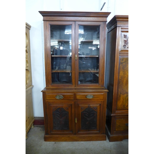 124 - A Victorian carved walnut bookcase