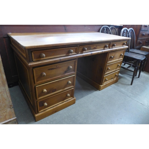 127 - A pine pedestal desk