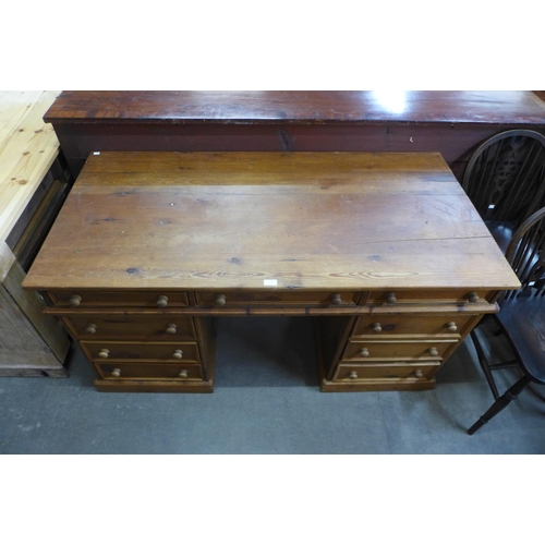 127 - A pine pedestal desk