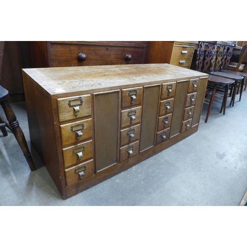 131 - An oak double sided index drawer cabinet